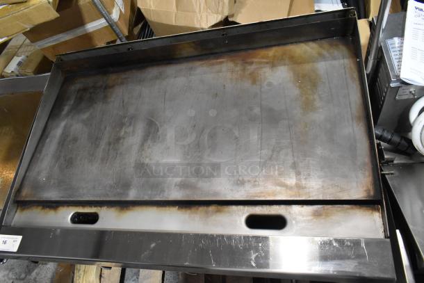 Garland stainless steel commercial countertop flat top griddle, like new, natural gas powered, minor surface discoloration.