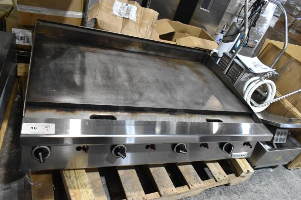 LIKE NEW Garland stainless steel commercial countertop natural gas flat top griddle; features control knobs; excellent condition.