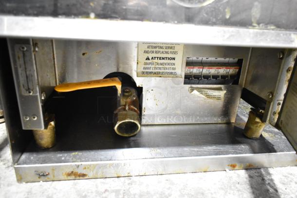 Giles GVH-C ventless hood system with electrostatic air cleaner. Features visible internal components and caution labels.