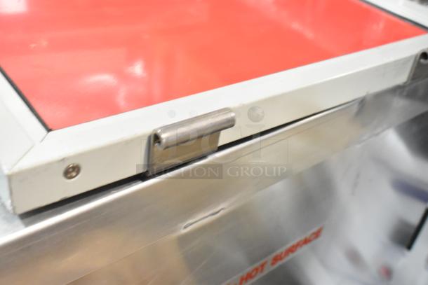 Brand new Avantco 177HTIS1812 undercounter insulated heated cabinet, stainless steel, on casters, minor dent visible.