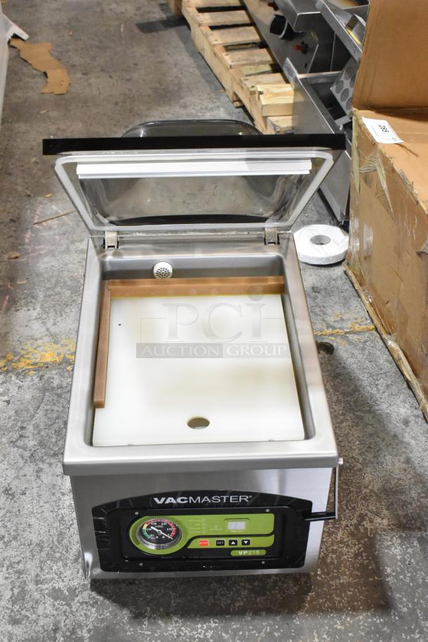 Vacmaster VP215 stainless steel chamber vacuum sealer, countertop model, 120V, 1 Phase, digital controls visible, open lid.