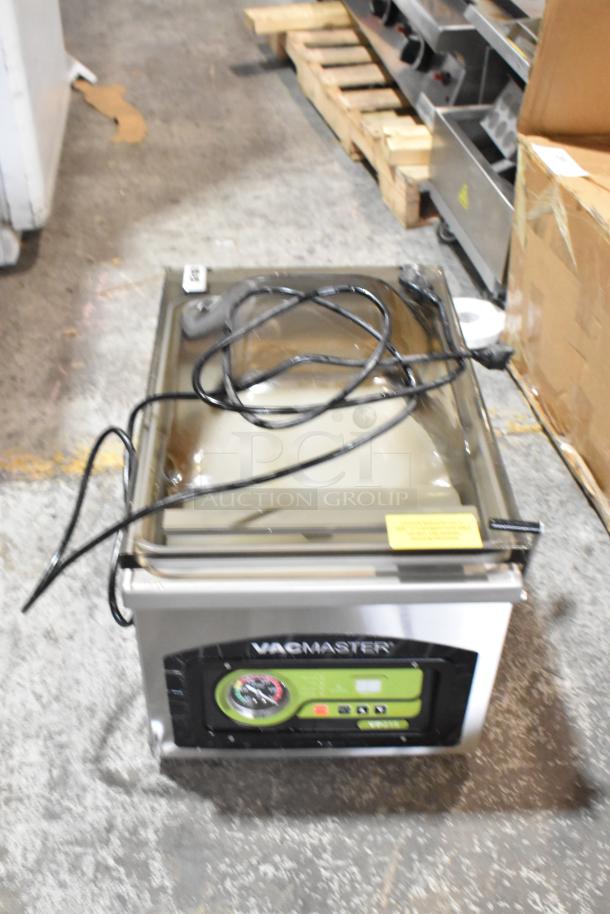 Vacmaster VP215 stainless steel chamber vacuum sealer with digital controls. Model VP215, 120 volts, 1 phase. Visible power cord.