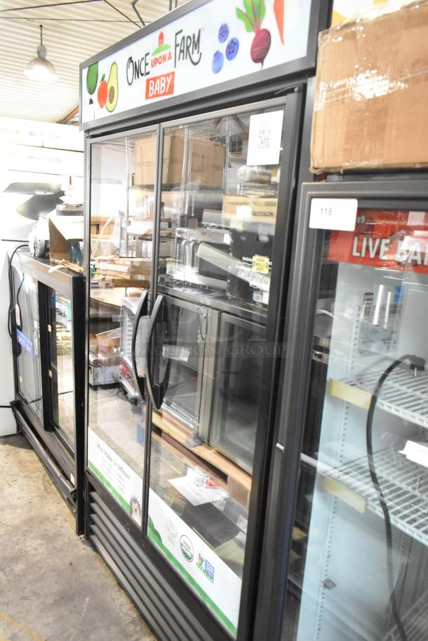 True TVM-48SL-HC commercial 2-door reach-in cooler with metal racks, 115V, 1 phase. Features glass doors and vibrant graphics.