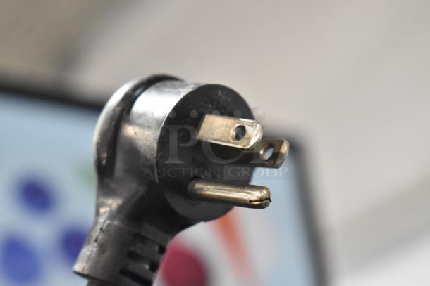 Close-up of a plug for the True GDM-12-HC-LD reach-in cooler merchandiser, 115 volts, 1 phase.