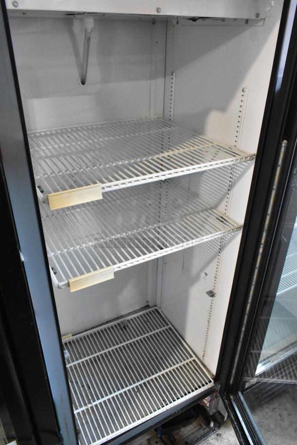 2017 True GDM-12-HC-LD single door cooler, metal, with poly coated racks. 115 Volts, 1 Phase. Clean interior condition.