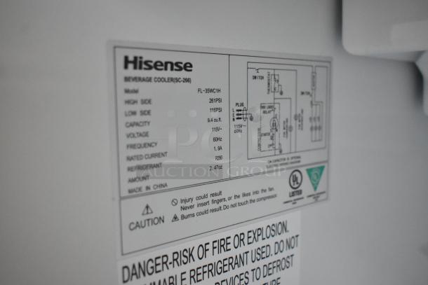 Label on Hisense FL-35WC1H cooler showing model specs: 9.4 cu.ft., 115V, R290 refrigerant, UL listed for safety.
