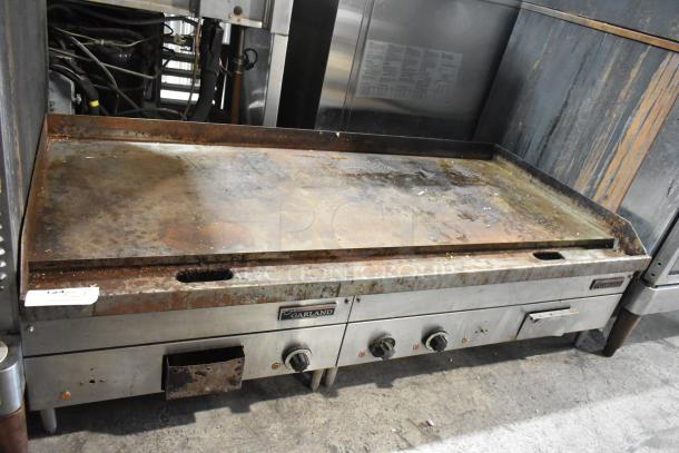 Garland stainless steel electric griddle, commercial countertop model, 240 volts, used condition with visible wear and knobs.
