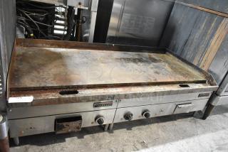 Garland stainless steel electric griddle, commercial countertop model, 240 volts, used condition with visible wear and knobs.