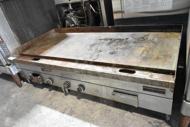 Garland stainless steel commercial electric griddle, countertop model, worn condition, 240 volts, visible brand label.