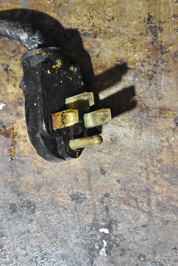 Garland commercial electric griddle plug, 240V, shows some signs of wear. Ideal for professional kitchen use.