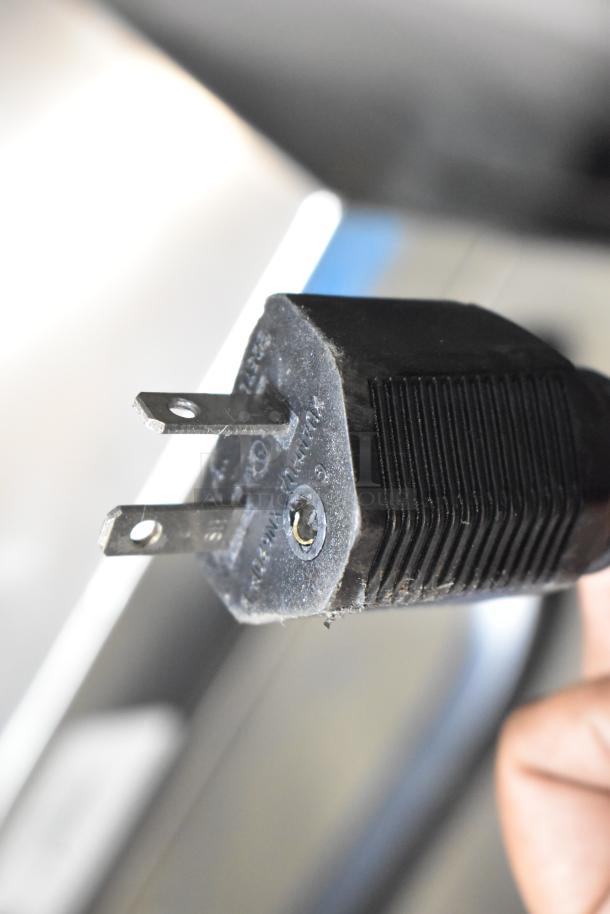 Close-up of a two-prong plug for the Mainstreet 541HTUC30 high-temp undercounter dishwasher, 208/240 volts, 1 phase.