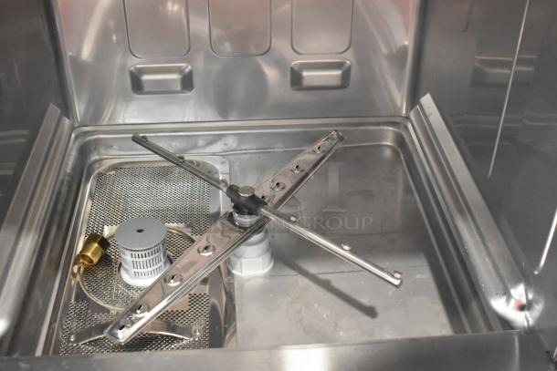 Stainless steel interior of Mainstreet 541HTUC30 undercounter dishwasher showing spray arms and filter. Brand new, scratch and dent.