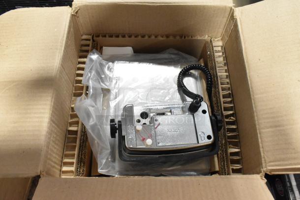 Brand new Tor Rey PPC-5/10 digital scale in box, 10 lb capacity, remote indicator, foot pedal, slight scratches and dents visible.