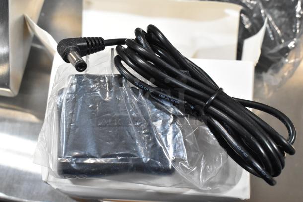 Brand new Tor Rey PPC-5/10 digital scale with remote indicator, foot pedal, and power adapter, shown in original packaging.