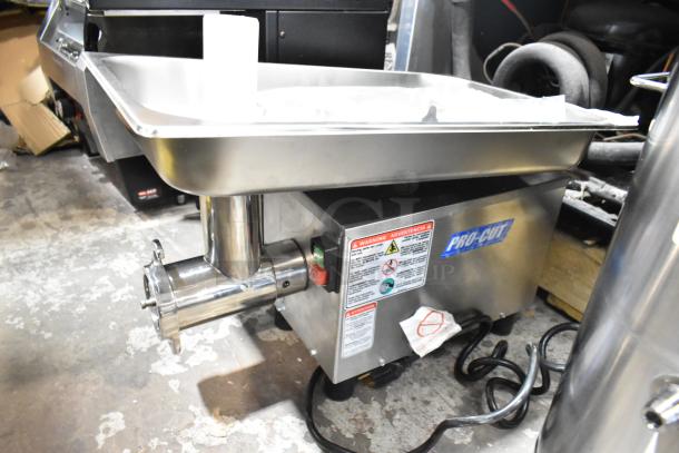 BRAND NEW Pro-Cut KG-12-SS stainless steel commercial electric meat grinder, #12, 115V, 1 Phase, with warning labels.