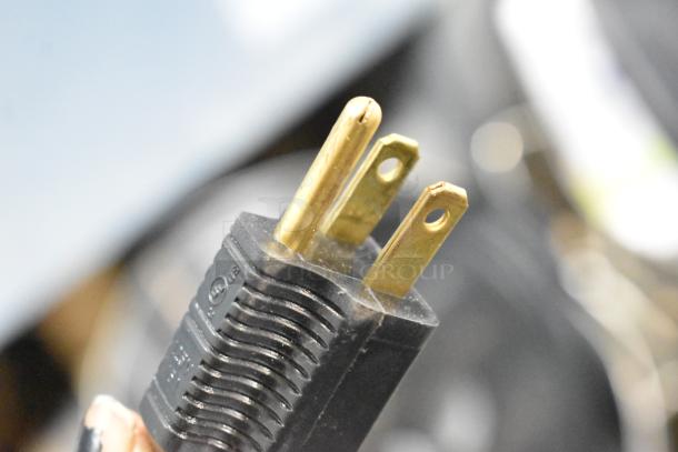 Close-up of a 115V electrical plug for the Pro-Cut KG-12-SS stainless steel meat grinder.