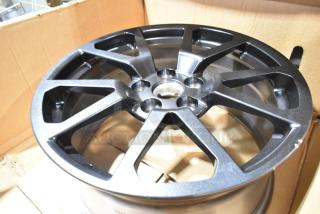Brand new box of 2 GM 19303155 rims, sleek black finish, in excellent condition, packaged in original cardboard box.