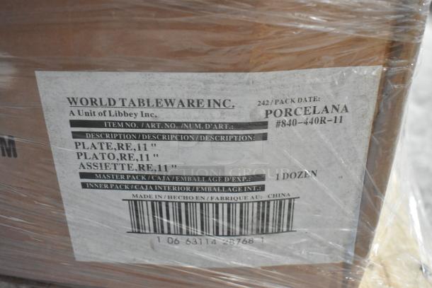 Box of World Tableware Inc. plates, 11-inch diameter, labeled "Porcelana #840-440R-11," 1 dozen per pack, made in China.