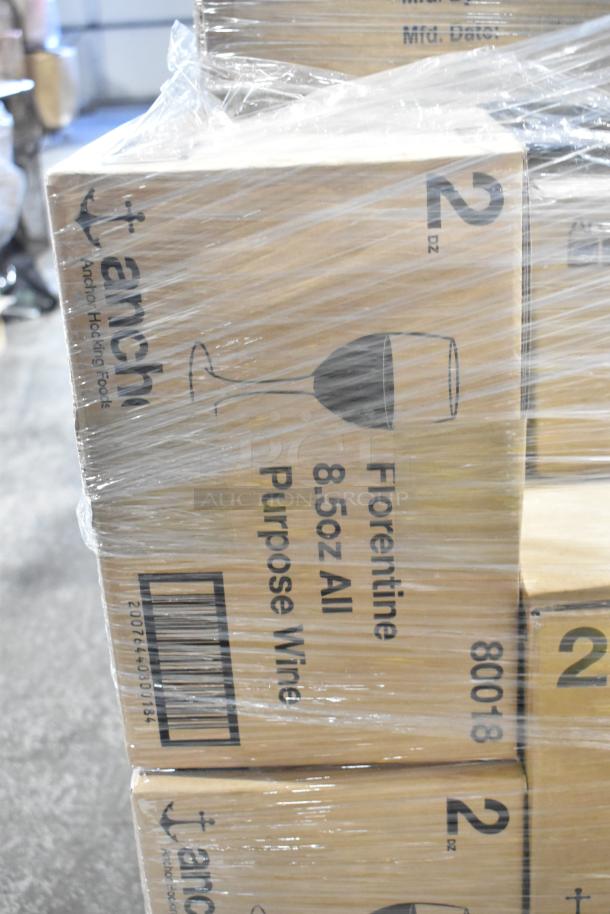 27 boxes of Anchor Florentine 8.5oz wine glasses, wrapped, showing labels and markings indicating new scratch and dent condition.
