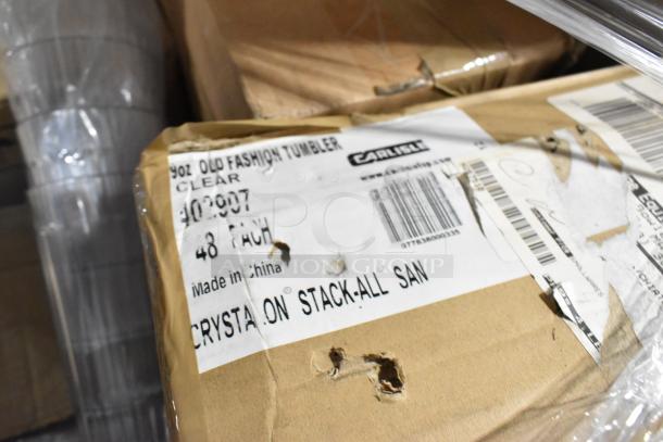 Boxes labeled "Carlisle 9oz Old Fashion Tumbler, Clear, 48 Pack, Made in China." Some scratches and dents visible.