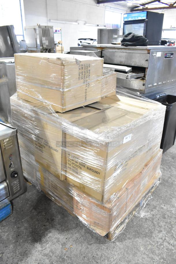 Pallet of 15 new scratch and dent boxes, featuring burgundy bucket seats, World Tableware 7oz cups, Buffalo cream plates.