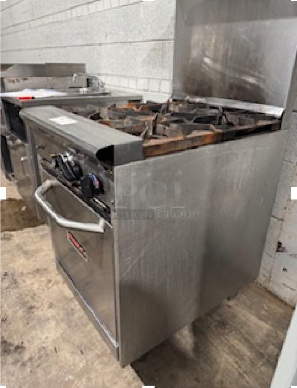 Tri-Star TSR-4 24" commercial gas range with 4 heavy-duty burners, chrome rack, and storage base. Tested and working.
