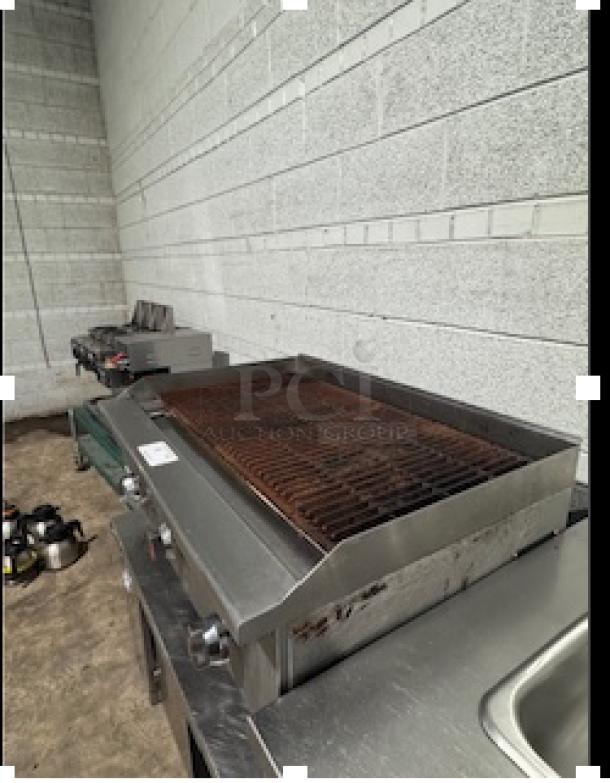 Patriot gas countertop charbroiler, model FMECTC-36/NG, shows signs of use. Features 30,000 BTU per burner, 3/4" rear NPT.