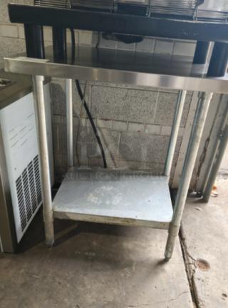 Regency 30" x 36" stainless steel work table with undershelf, 16-gauge, 304 model, shown in used condition.