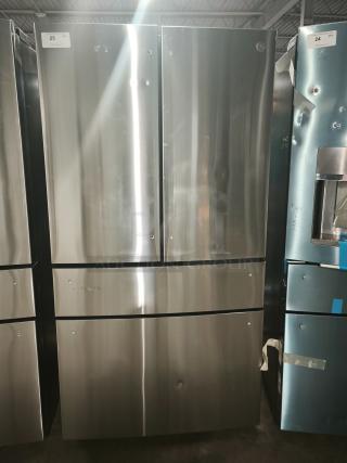 GE Profile™ 28.7 cu ft Smart 4-Door French Door Refrigerator, model PGE29BYTFS, fingerprint-resistant, visible dents.