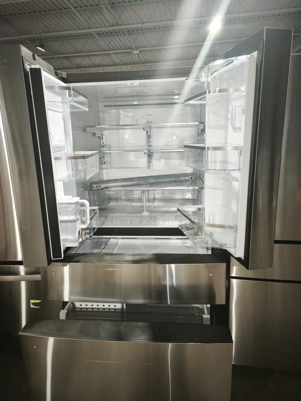 GE Profile™ 28.7 cu ft 4-Door French Door Refrigerator, model PGE29BYTFS, stainless steel, open with visible shelves.