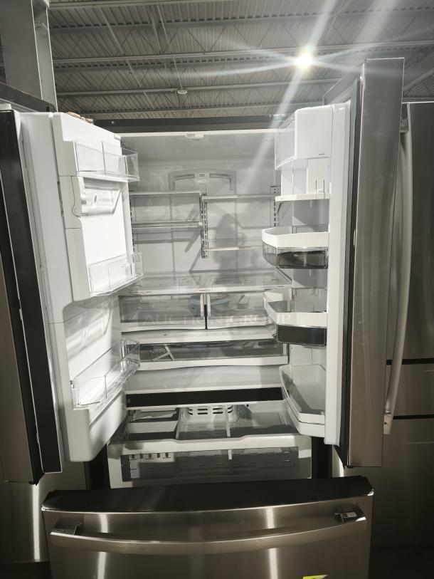 GE 27.7 Cu. Ft. French-Door Refrigerator, model GFE28GYNFS, in stainless steel, fingerprint-resistant, spacious interior.