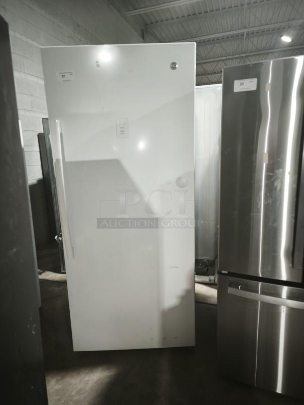 GE 21.3 Cu. Ft. Frost-Free Upright Freezer, Model GFE28GYNFS, garage-ready, white exterior, good condition.