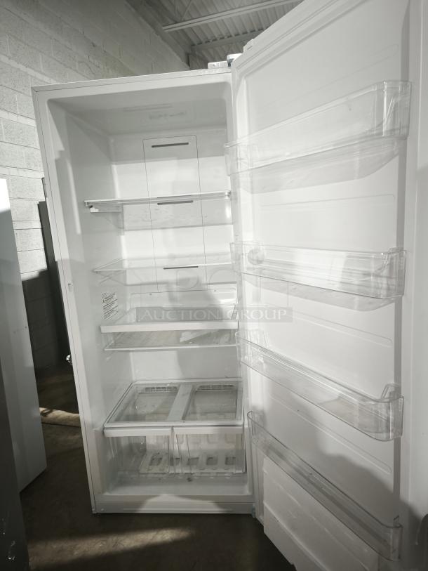 GE 21.3 Cu. Ft. Frost-Free Upright Freezer, Model GFE28GYNFS, garage ready, spacious interior, multiple shelves, pristine condition.