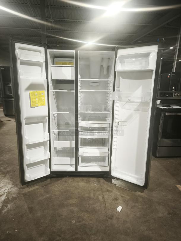 GE 21.8 cu ft side-by-side fridge, model GZS22IYNFS, fingerprint-resistant, counter-depth, open doors show interior shelves.