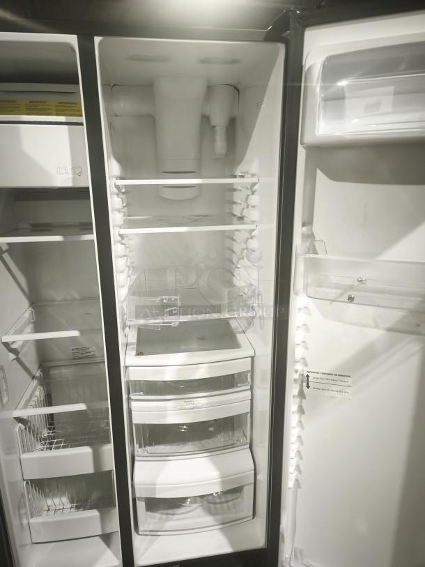 GE 21.8 cu ft side-by-side refrigerator, model GZS22IYNFS, fingerprint-resistant finish, open doors showing shelves and bins.