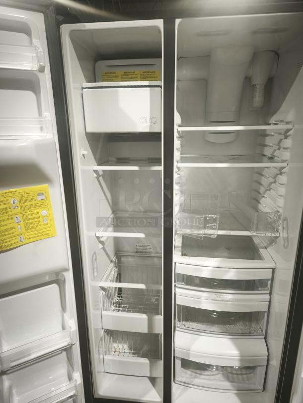 GE 21.8 cu ft Counter-Depth Side-by-Side Refrigerator, Model GZS22IYNFS. Fingerprint-resistant, new condition. Features ice maker, adjustable shelves, and clear drawers.