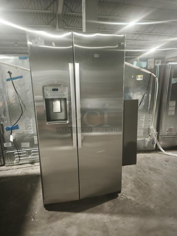 GE 21.8 cu ft counter-depth side-by-side refrigerator, model GZS22IYNFS. Fingerprint-resistant finish, excellent condition.