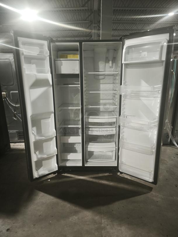 GE 21.8 cu ft side-by-side refrigerator, model GZS22IYNFS, fingerprint-resistant, counter-depth, doors open, interior view.