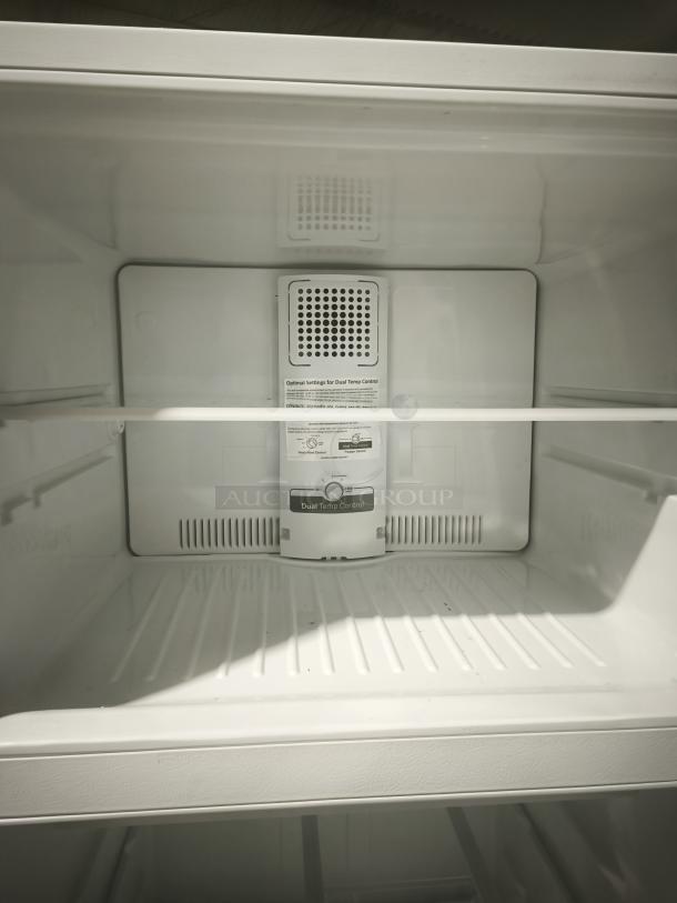 GE 21.9 cu ft top-freezer refrigerator interior. Model GTS22KGNRWW. Features dual temp control. Garage-ready. Mint condition.