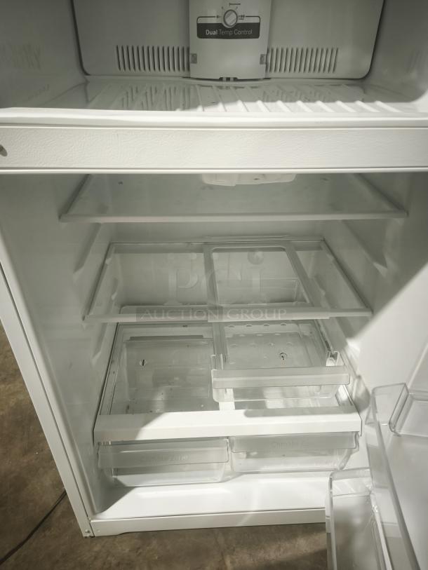 GE 21.9 cu ft top-freezer refrigerator, Model GTS22KGNRWW, garage-ready, dual temp control, spacious interior, excellent condition.