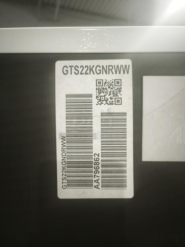 Label on GE 21.9 cu ft top-freezer refrigerator, model GTS22KGNRWW, with barcode and QR code.