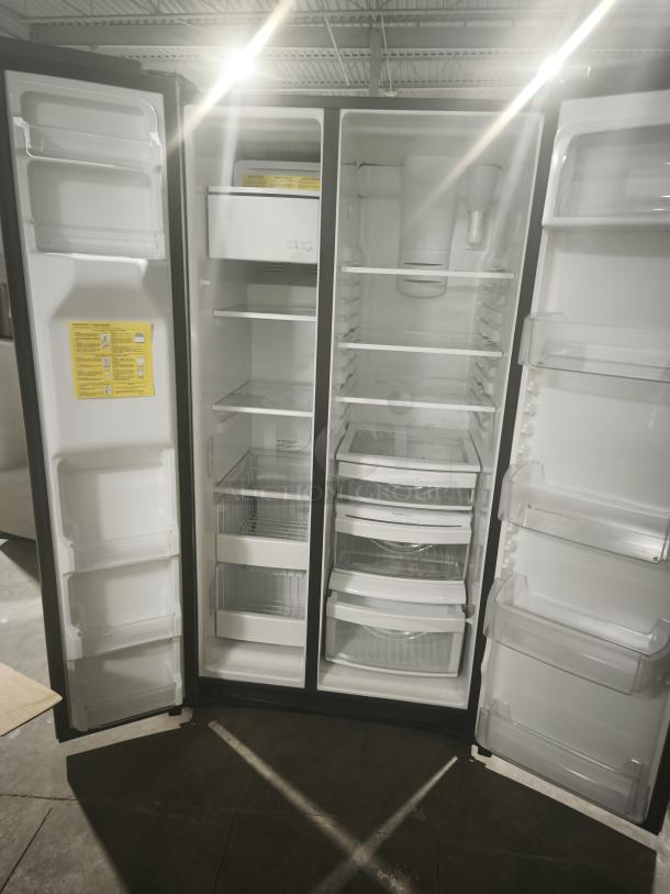 GE 25.1 cu. ft. side-by-side refrigerator, model GSS25IYNFS, fingerprint-resistant, spacious interior, excellent condition.
