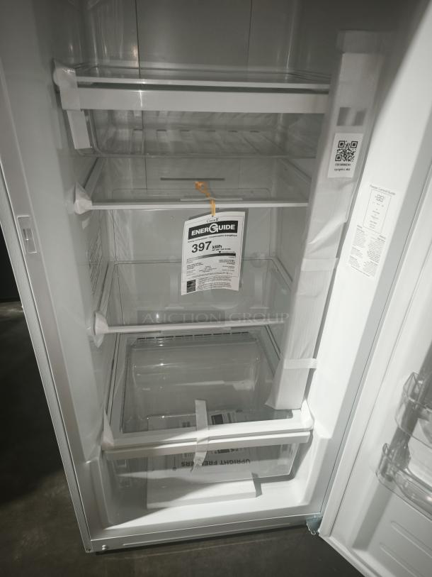 GE 14.1 Cu. Ft. Frost-Free Garage-Ready Upright Freezer, model FUF14DLRWW, featuring adjustable shelves and EnergyGuide label.