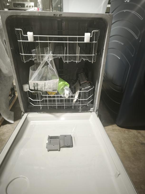 BRAND NEW scratch and dent GE dishwasher, model GDT665SSNSS, with sanitize cycle, dry boost, and plastic interior.