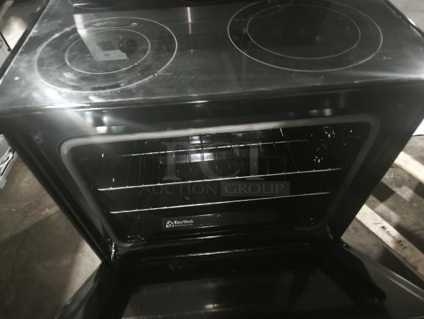 BRAND NEW SCRATCH AND DENT: GE® 30-inch Electric Convection Range, Model GRF600AVSS, open oven view, Smart/WiFi features.