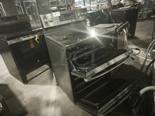 GE JBS86SPSS free-standing electric double oven convection range, brand new with minor scratches and dents.