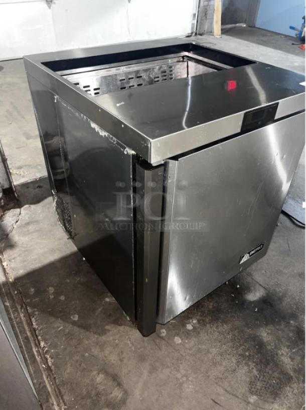 BERG BERS27 8 Pan 1-Door Sandwich Prep Table in stainless steel, showing minor wear, enhances kitchen efficiency.