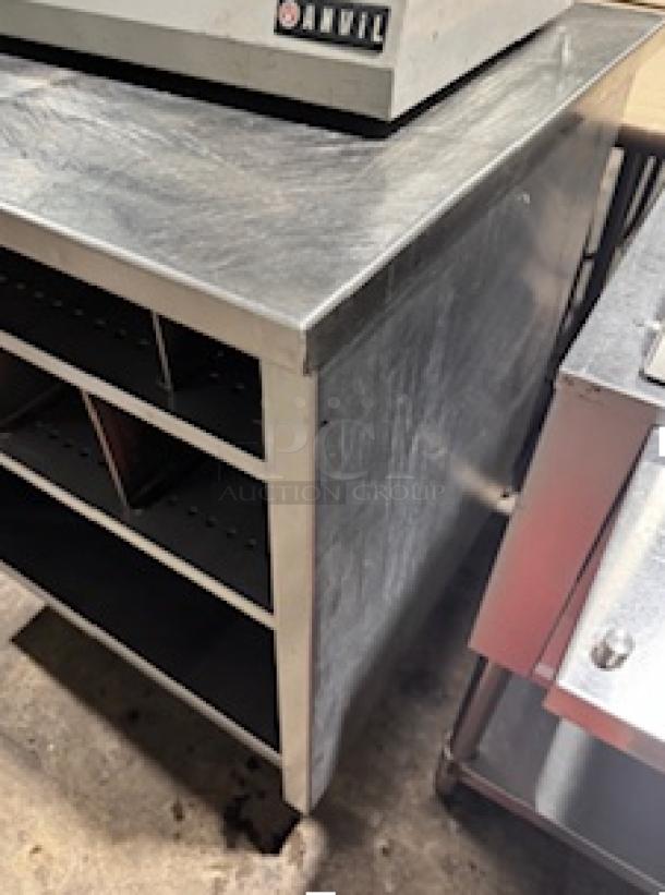 S&G Manufacturing BERS27 stainless steel table, custom design, includes open shelving, durable condition, industrial use.