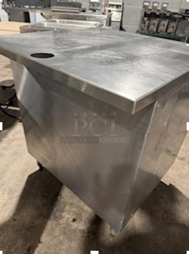 NICE CUSTOM stainless steel table, S&G Manufacturing, Model BERS27, sleek design, good condition, on casters.