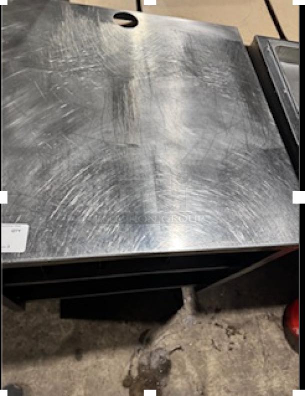 NICE custom stainless steel table by S&G Manufacturing, model BERS27, features a durable top with visible surface marks.